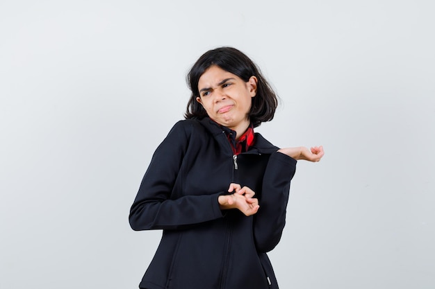 Expressive young girl posing in the studio