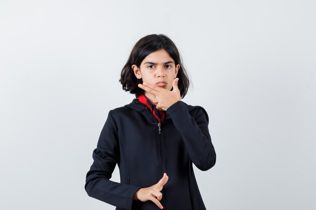 Expressive young girl posing in the studio