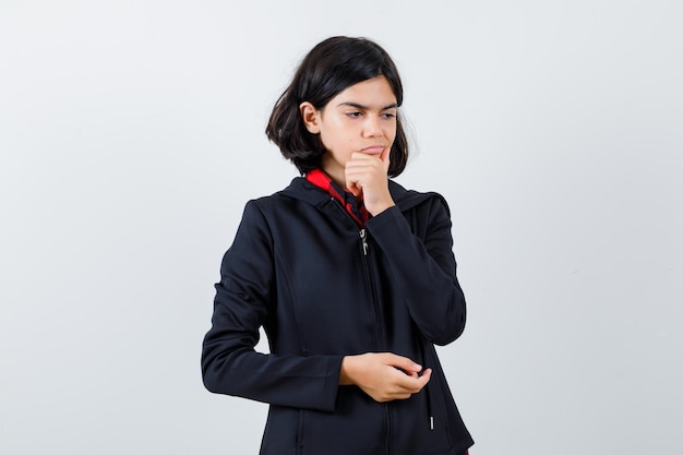 Expressive young girl posing in the studio