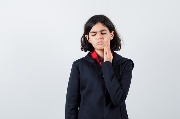 Expressive young girl posing in the studio