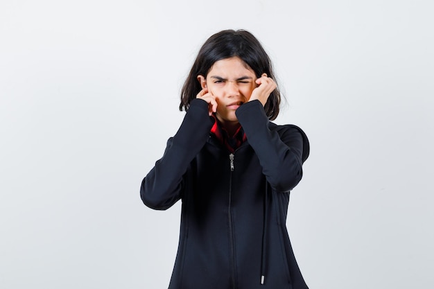 Expressive young girl posing in the studio