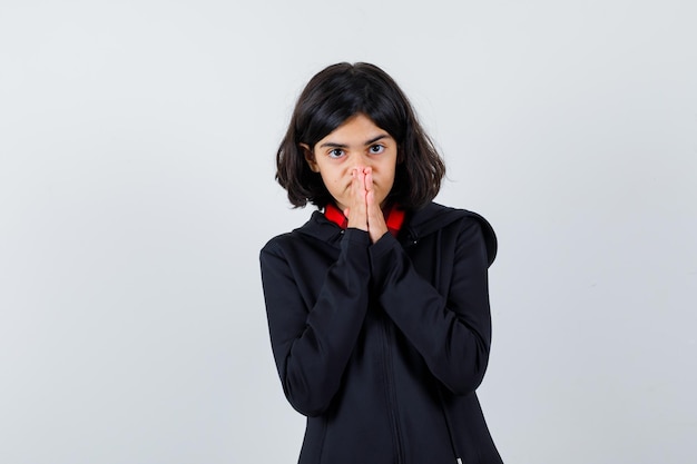 Expressive young girl posing in the studio