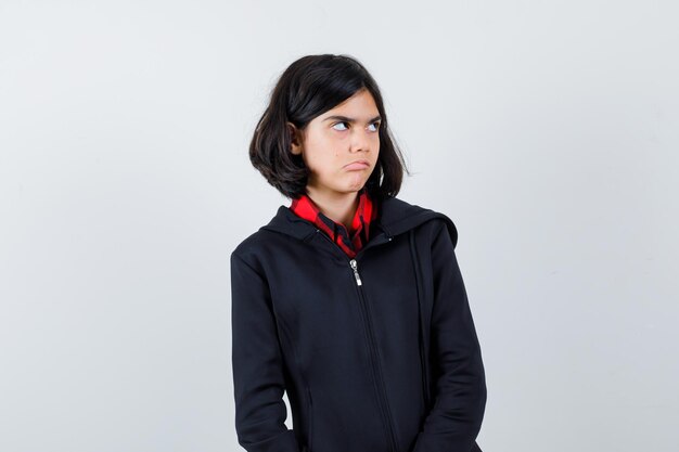 Expressive young girl posing in the studio