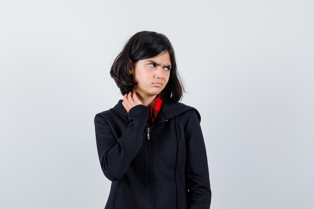 Expressive young girl posing in the studio