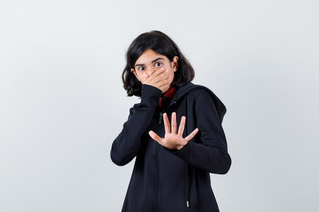 Expressive young girl posing in the studio