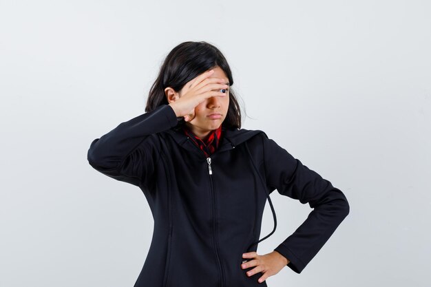 Expressive young girl posing in the studio