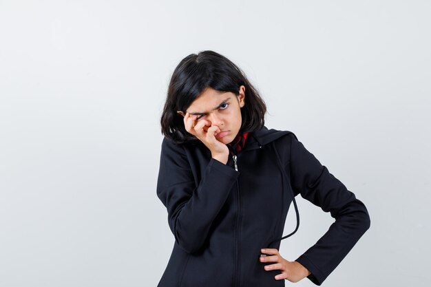 Expressive young girl posing in the studio