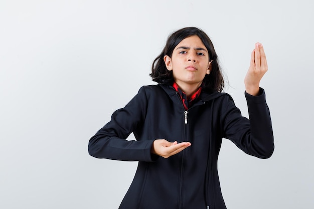 Expressive young girl posing in the studio