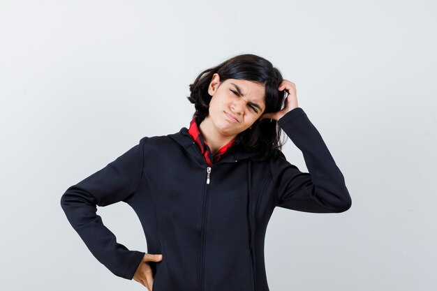 Expressive young girl posing in the studio