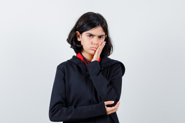 Expressive young girl posing in the studio