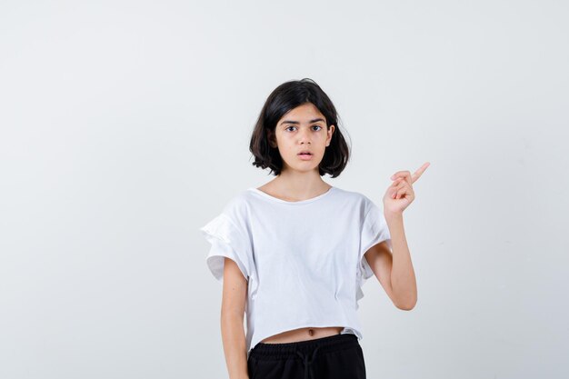 Expressive young girl posing in the studio