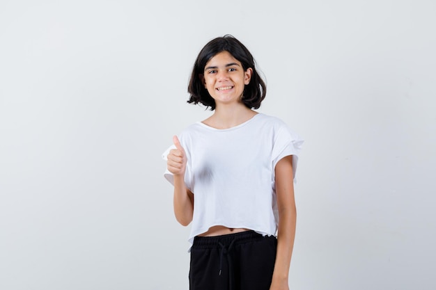 Expressive young girl posing in the studio