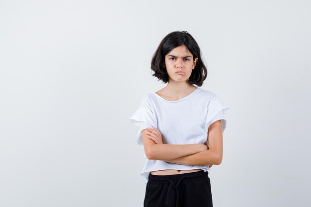 Expressive young girl posing in the studio