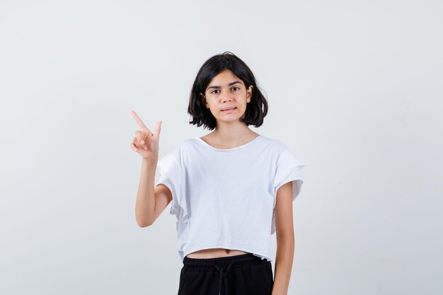 Expressive young girl posing in the studio