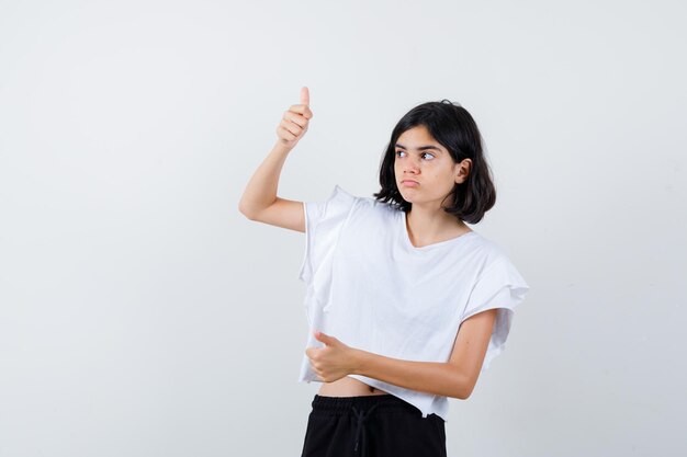 Expressive young girl posing in the studio