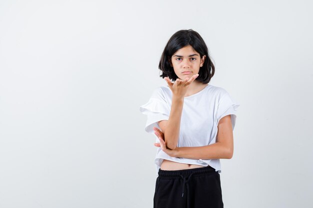 Expressive young girl posing in the studio