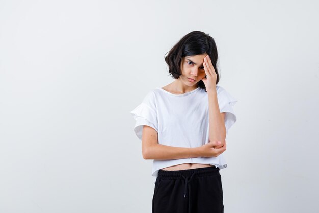 Expressive young girl posing in the studio