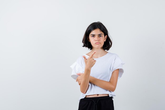 Expressive young girl posing in the studio