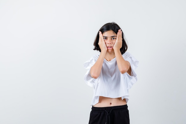 Expressive young girl posing in the studio