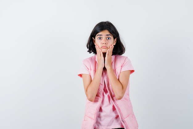 Expressive young girl posing in the studio