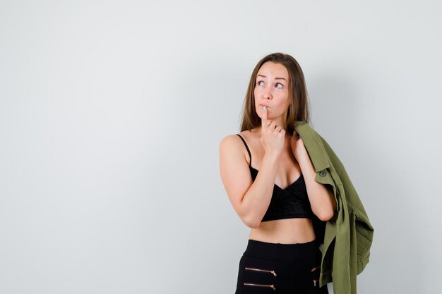 Expressive young girl posing in the studio