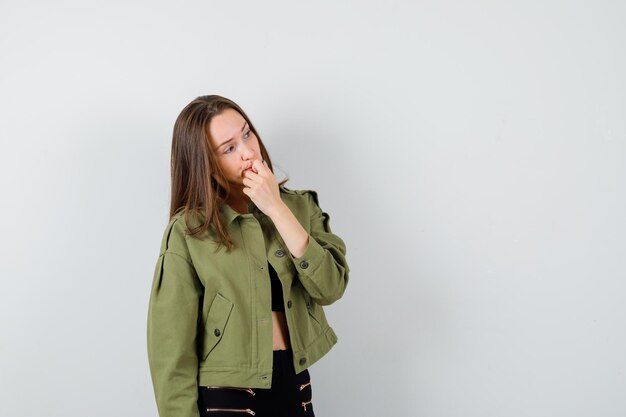 Expressive young girl posing in the studio