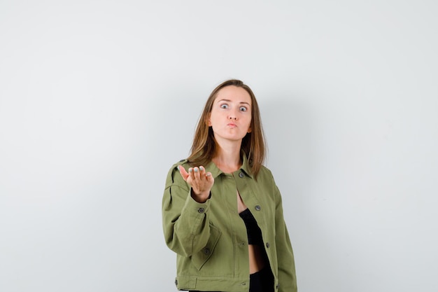 Expressive young girl posing in the studio