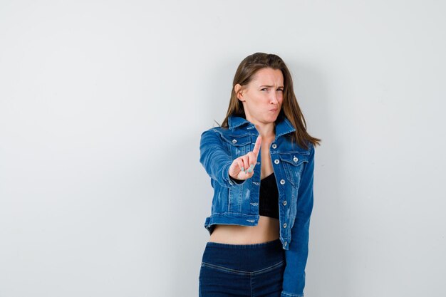 Expressive young girl posing in the studio