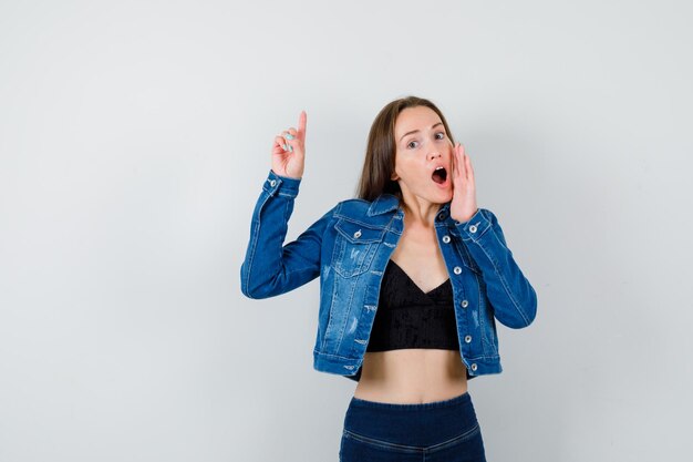 Expressive young girl posing in the studio