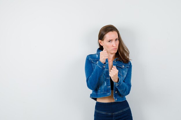 Expressive young girl posing in the studio