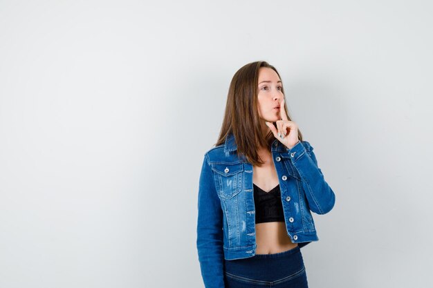 Expressive young girl posing in the studio