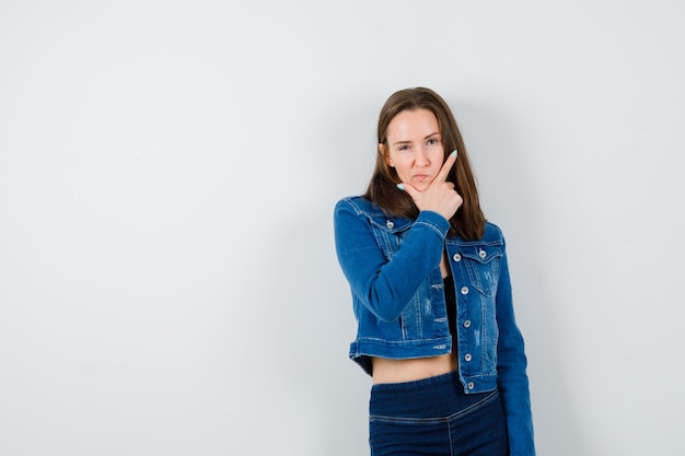 Expressive young girl posing in the studio