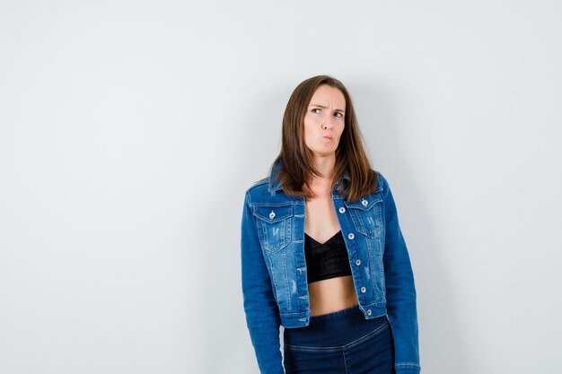 Expressive young girl posing in the studio