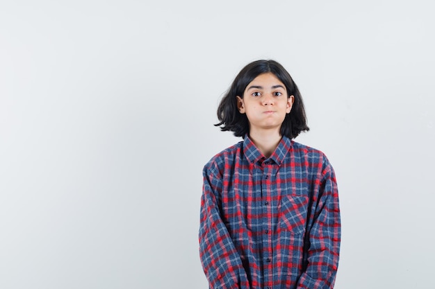 Expressive young girl posing in the studio