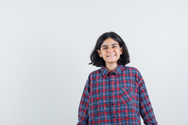 Expressive young girl posing in the studio