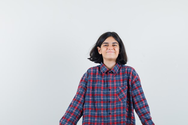 Expressive young girl posing in the studio