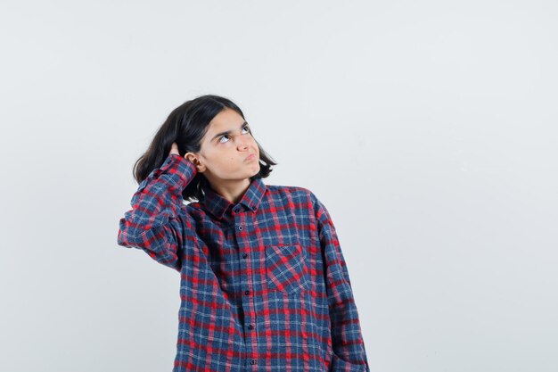 Expressive young girl posing in the studio