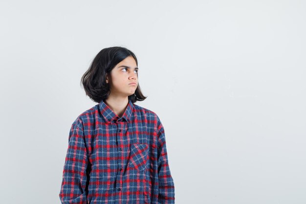 Expressive young girl posing in the studio