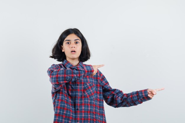 Expressive young girl posing in the studio