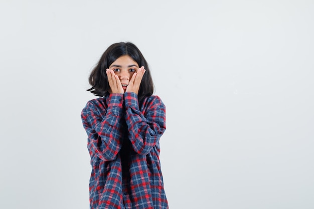 Expressive young girl posing in the studio