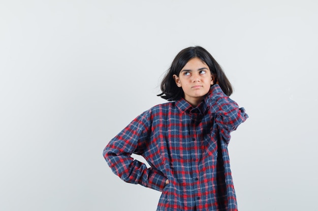 Expressive young girl posing in the studio