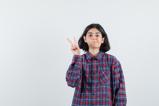 Expressive young girl posing in the studio