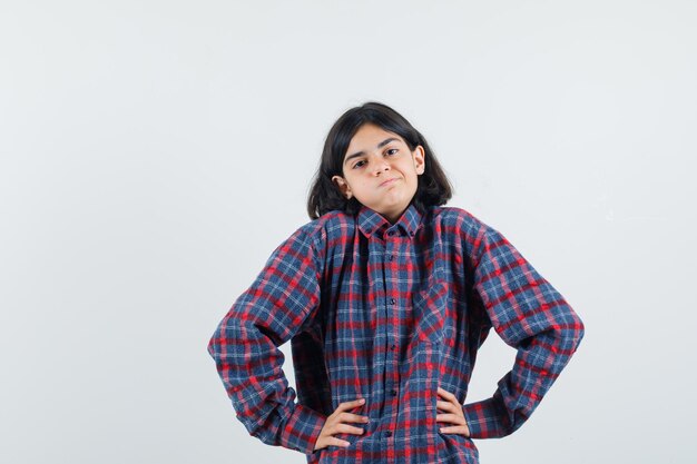 Expressive young girl posing in the studio