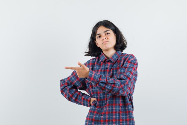 Expressive young girl posing in the studio