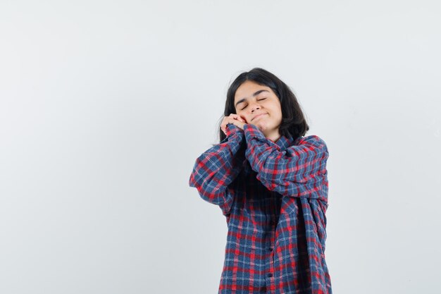 Expressive young girl posing in the studio