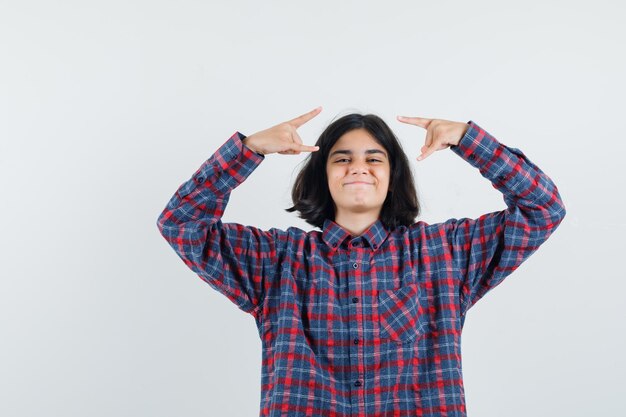 Expressive young girl posing in the studio