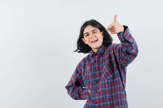 Expressive young girl posing in the studio