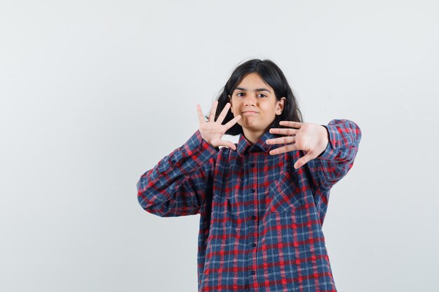 Expressive young girl posing in the studio