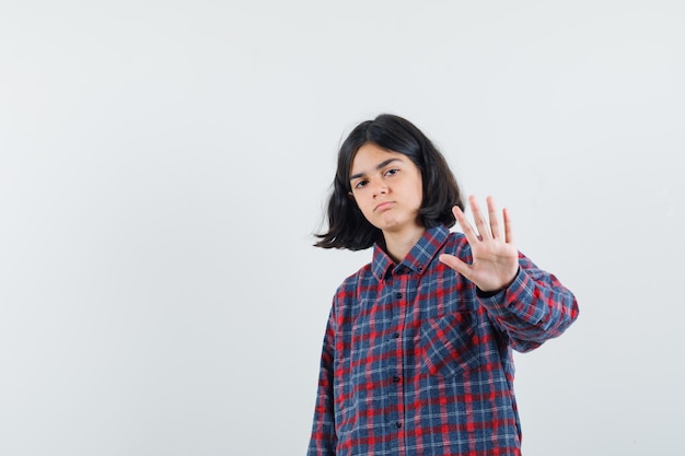 Expressive young girl posing in the studio