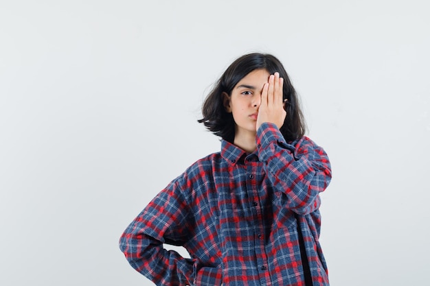 Expressive young girl posing in the studio